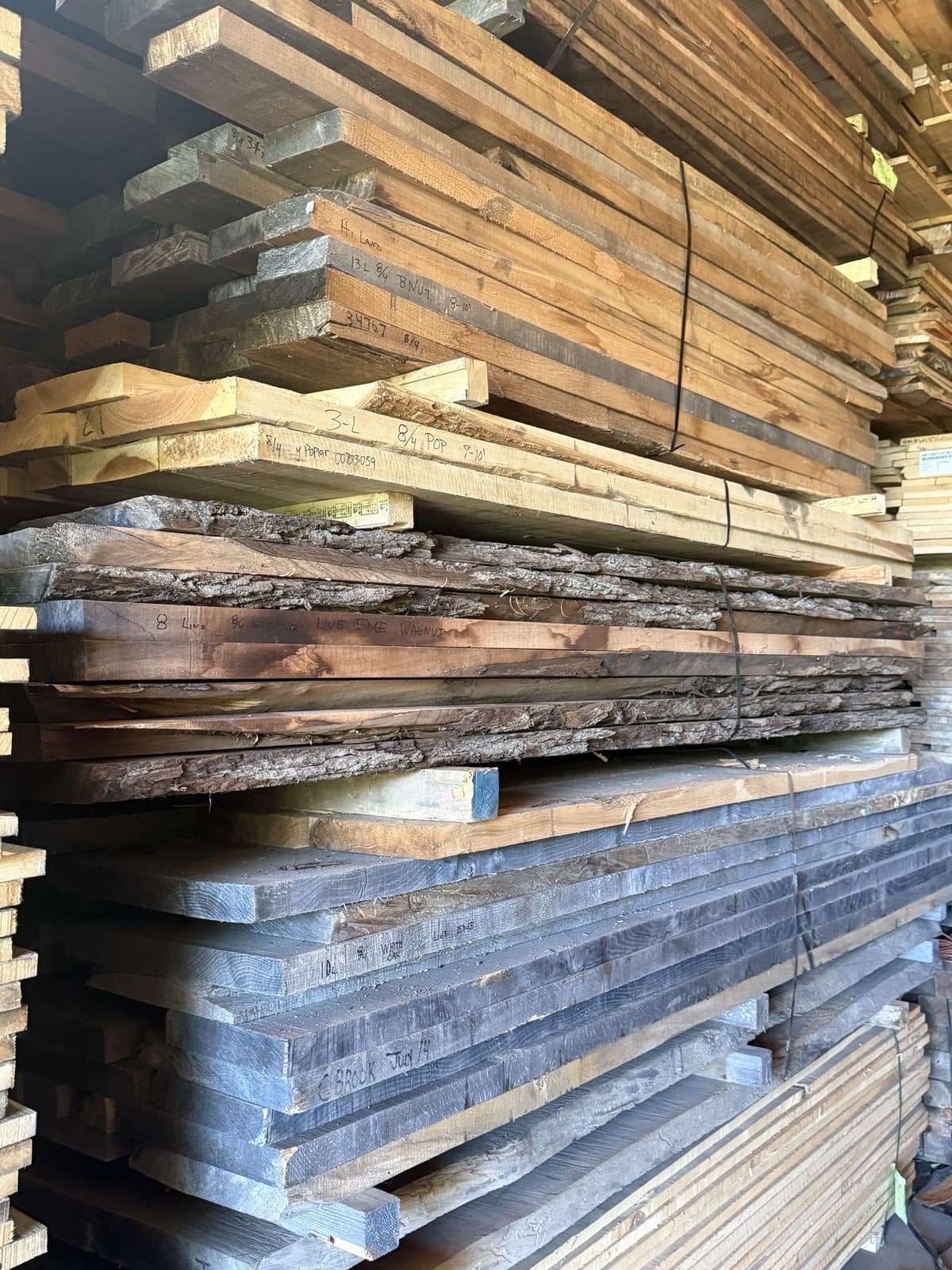 Live edge slabs on the rack at the shop