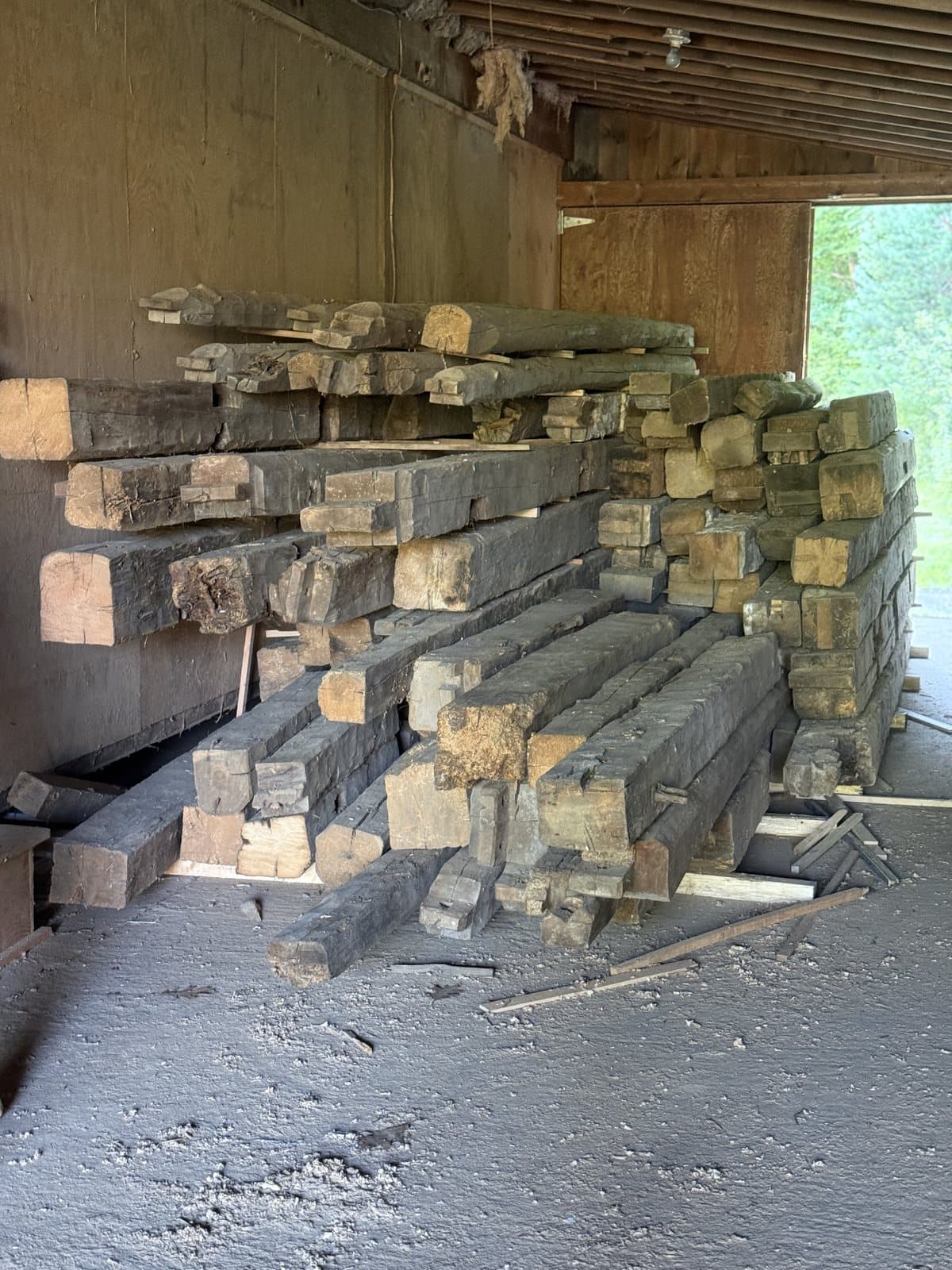 Weathered barn boards and a hand hewn beam