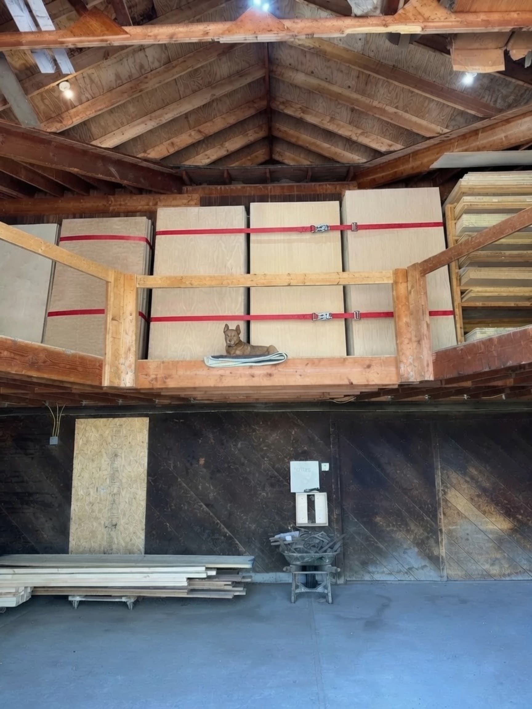 Plywood sheets strapped on the shop mezzanine