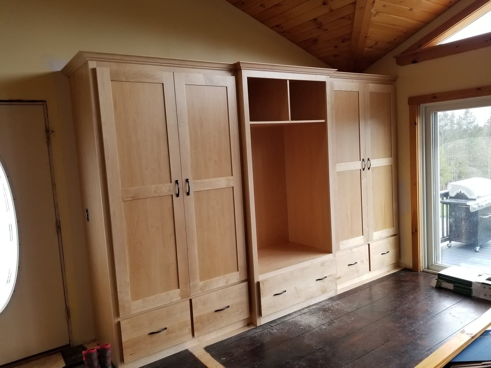 Floor-to-ceiling cherry pantry, going in