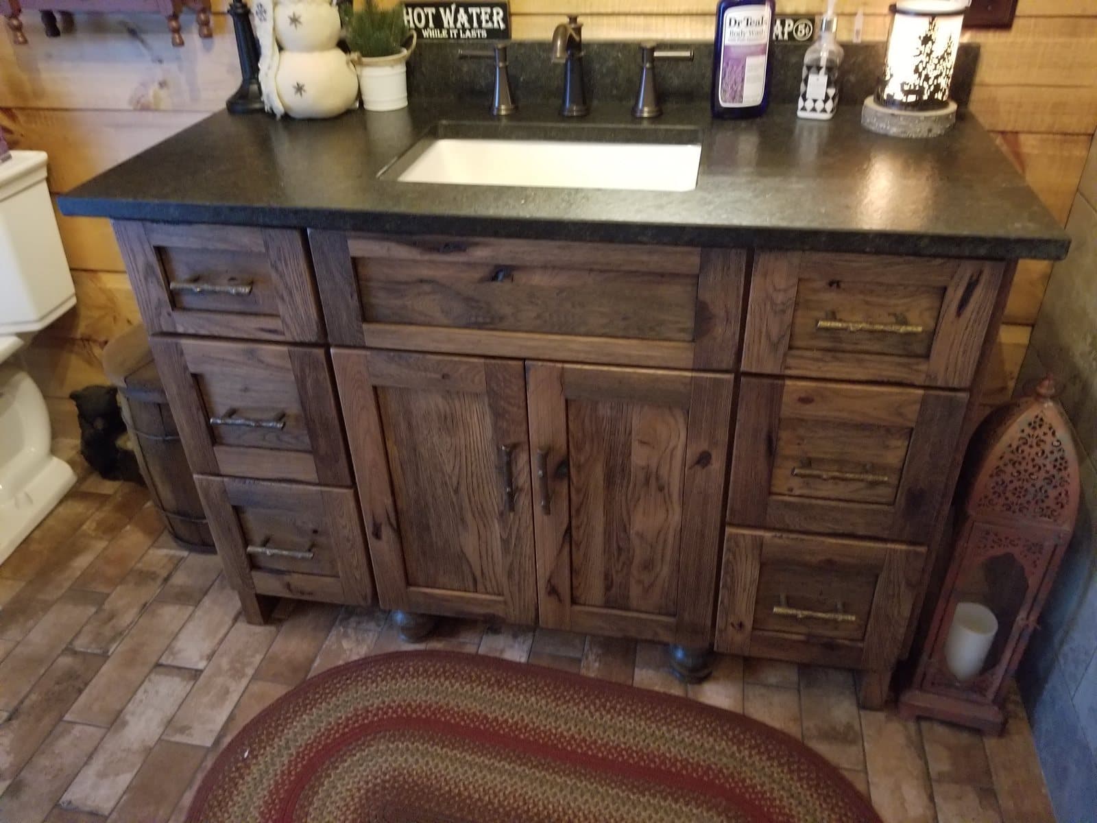 Rustic vanity with a dark stone top