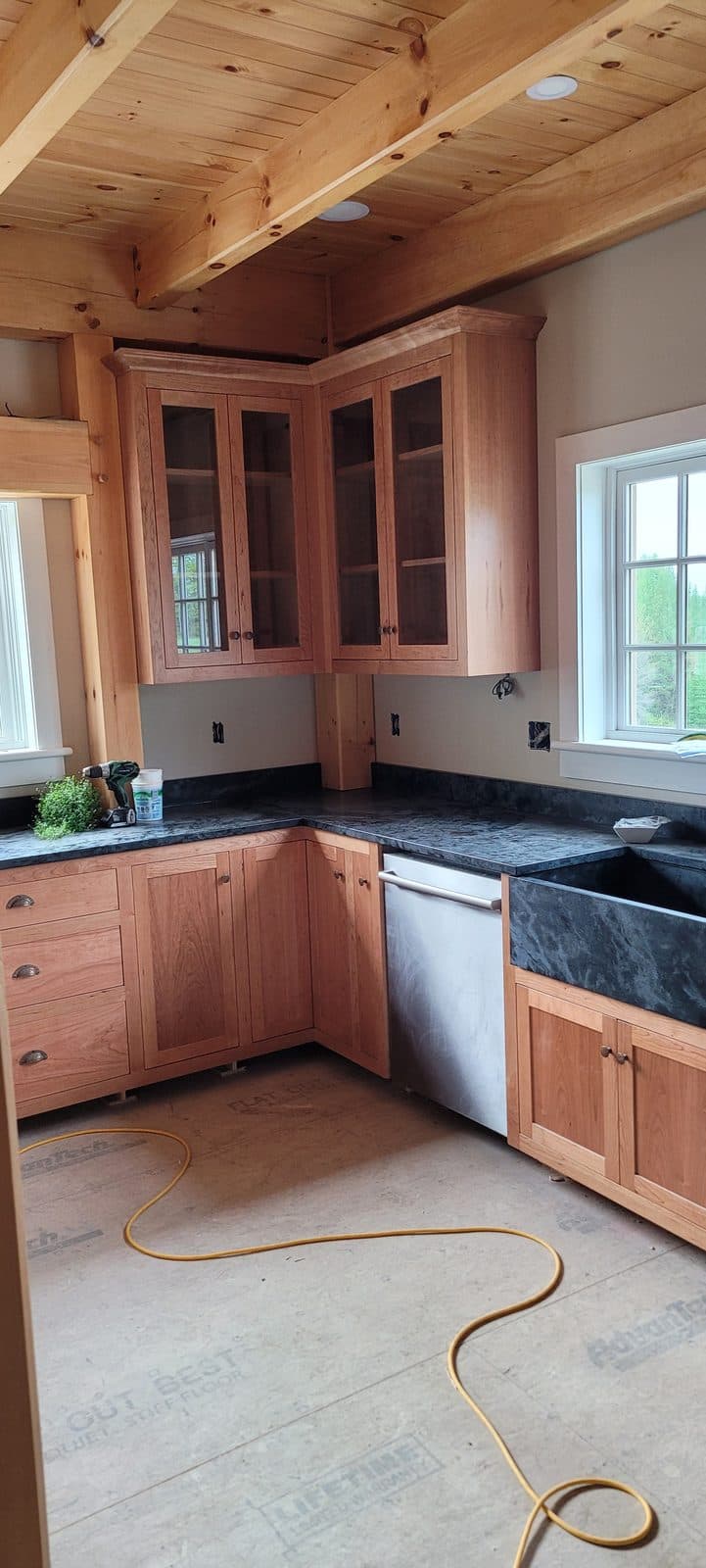 Cherry kitchen with soapstone counters, in a timber-frame home