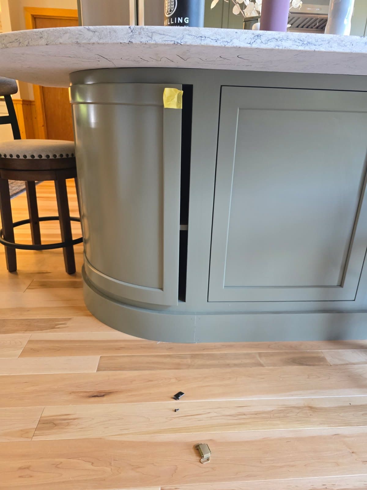 Painted curved island with a quartz top